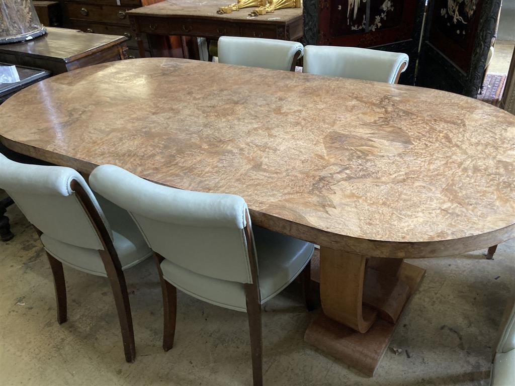 An Art Deco burr walnut dining table, width 214cm, depth 99cm, height 76cm together with four chairs